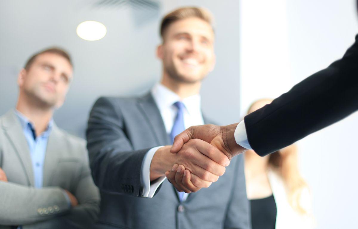 Business people shaking hands, finishing up a meeting