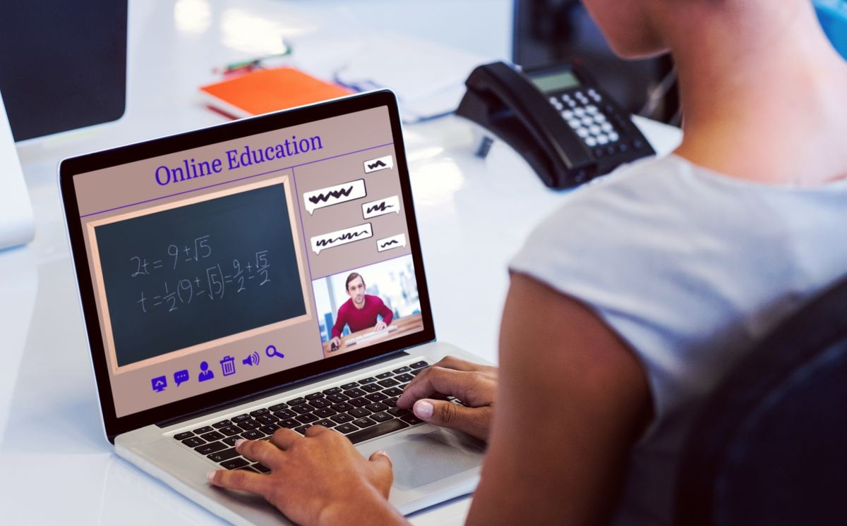 Composite image of online courses against woman working on laptop while sitting on chair